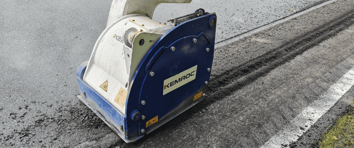 KEMROC EX patch planer attachment mills asphalt pavement, carving a clean trench for road repair and utility cable installation